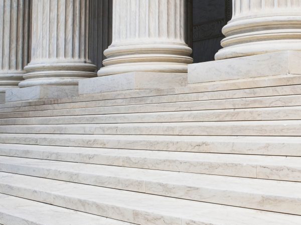 Marble steps and row of columns.